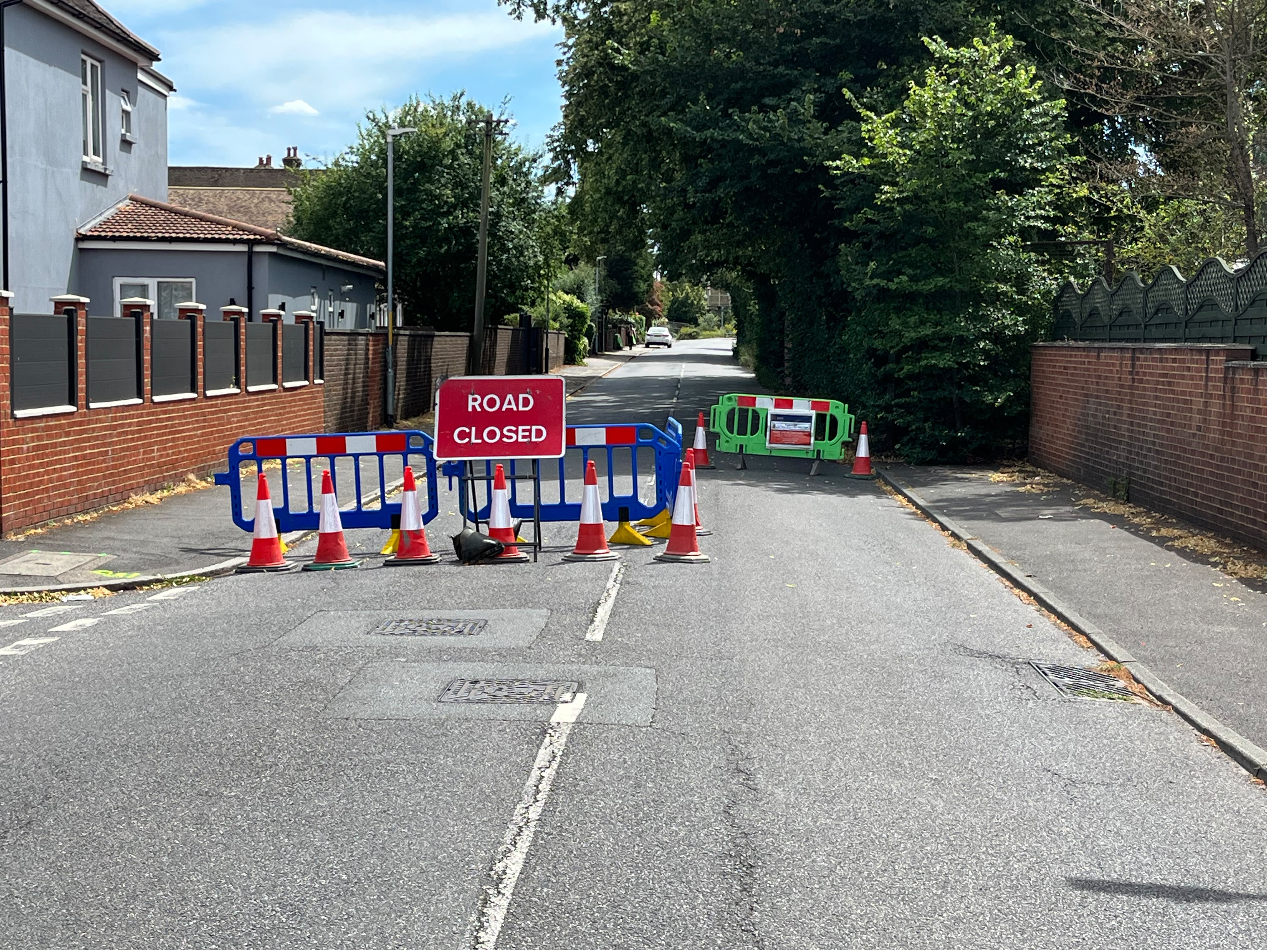 Road closed signs and barriers on Pilgrims Way.